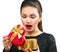 Surprised young woman opening heart shaped gift box