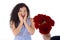 Surprised young woman receive bouquet of red roses.