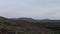 Surreal aerial view moonscape of Iceland desert countryside. Birds eye group of tourist explorer hikers walking pathway