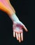 Surreal artistic hand composition. Creative artwork of human hands. Colorful paint. Dark background. Ai generated illustration