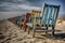 Surreal depiction of a neat row of wooden beach chairs with peeling paint on a landscape of dunes, made with generative ai