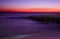 Surreal deserted sandy beach after dusk