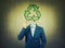 Surreal image as a businessman with invisible face holding a pencil in his hand draw recycle symbol instead of head. Ecology and