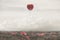 Surreal image of a rose petal shaped like a heart flying free in the sky