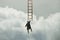 Surreal man clings to a ladder in the sky to reach the highest place , the concept is business and success