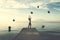 Surreal moment, woman tries to taking the black balloons that rain from the sky