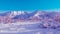 Surreal mountain landscape, purple  mountains and Christmas trees covered with snow