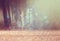 Surreal photo of young woman standing in forest. image is textured and toned. dreamy concept.