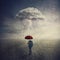 Surreal scene as man stands outdoors under umbrella due a single mysterious storm cloud raining only over him. Find solution to