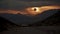 Surreal solar eclipse at sunset over mountains. Mystical eclipse illustration over a desert mountain range.