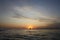 Surreal Sunset: Tranquil Waves and Ethereal Sky at Lake Michigan