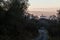 Surreal and uncommon view of St.Francis church in Assisi town Umbria over a sea of fog, at the end of a road in the