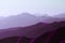 Surrealistic mountain landscape of purple hues