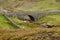 Surrender Road crossing Old Gang Beck on the stone Surrender Bridge , Yorkshire UK