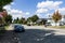 SURREY, CANADA - SEPTEMBER 19, 2018: city road in residential area with cars on a autumn sunny day