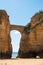 Surrounded by cliffs picturesque Praia dos Estudantes or sandy Beach of Students in Lagos, Algarve. Beautiful arch link one of the