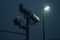 surveillance camera mounted on a street light. AI Generated