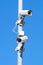 Surveillance cameras against blue sky Security Cctv