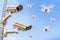 Surveillance Cameras With Drones Flying In The Sky