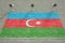 Surveillance cameras and wall with printed flag of Azerbaijan. National security system concept. 3D rendering