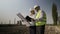 Survey young architect engineers team on energetic power plant completing analysis of projected work site -