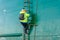 A surveyor climbs the ladder on board an oil tanker