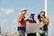 Surveyor and engineer Examine the efficiency of gigantic wind turbines that transform wind energy into electrical energy that is