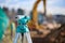 Surveyor equipment theodolite outdoors at construction site - blurry background