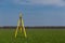 Surveyor equipment on a tripod in the field