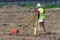 The surveyor is shooting at a building site