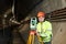 Surveyor with theodolite level at underground railway tunnel construction work