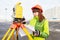 Surveyor works with theodolite