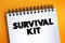 Survival Kit text on notepad, concept background