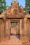 Survive of beautiful carved stone pillars and entrance of old temple in ruins of Banteay Srei, Cambodia