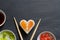 Sushi abstract seafood heart concept on black marble menu background