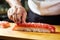 Sushi artistry: Japanese chef\\\'s hands prepare fresh rolls