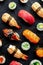 Sushi. An assortment of rolls, maki, nigiri etc, shot from the top on black