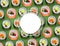 Sushi banner with fresh rolls pattern on green background and white round sticker with empty space for text.