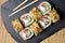 Sushi bonito roll on a dark background. Top view of sushi . Sushi food photo for menu