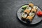 Sushi Bonito with salmon, cheese and tuna chips.