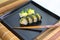 sushi on a ceramic plate in a traditional asian recipe