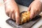 Sushi chef lays out a roll in tuna shavings on a rectangular plate