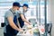 Sushi delivery. Masked and gloved chefs prepare sushi In the Restaurant`s kitchen.