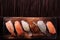 Sushi japanese food various wood tray flat top view bottom border
