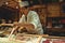 Sushi master chef preparing fresh sashimi for hungry customers in a luxury sushi restaurant in Tokyo Japan