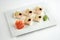 Sushi with perch, lime and black caviar