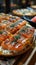 Sushi pizza combines elements of sushi and pizza in one dish.