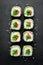 Sushi roll with avocado, cucumber and tomato.