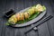 Sushi roll dragon with smoked eel and avocado