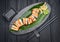 Sushi roll dragon with smoked eel and shrimp